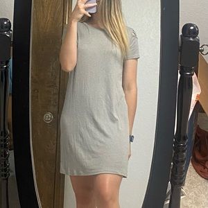 Comfy t-shirt dress with criss cross pattern on the shoulder.